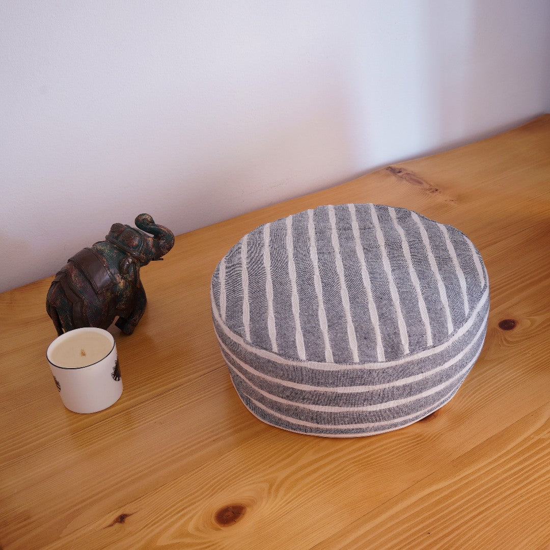 Cremna Handmade Zafu Yoga / Meditation Cushion, zafu product photo on wooden surface with decor objects