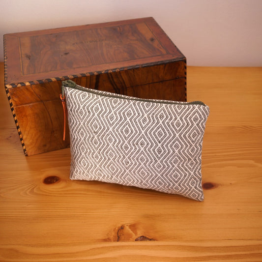 Sardis Handwoven Cotton Makeup Bag, clutch cosmetic bag angled with decor box